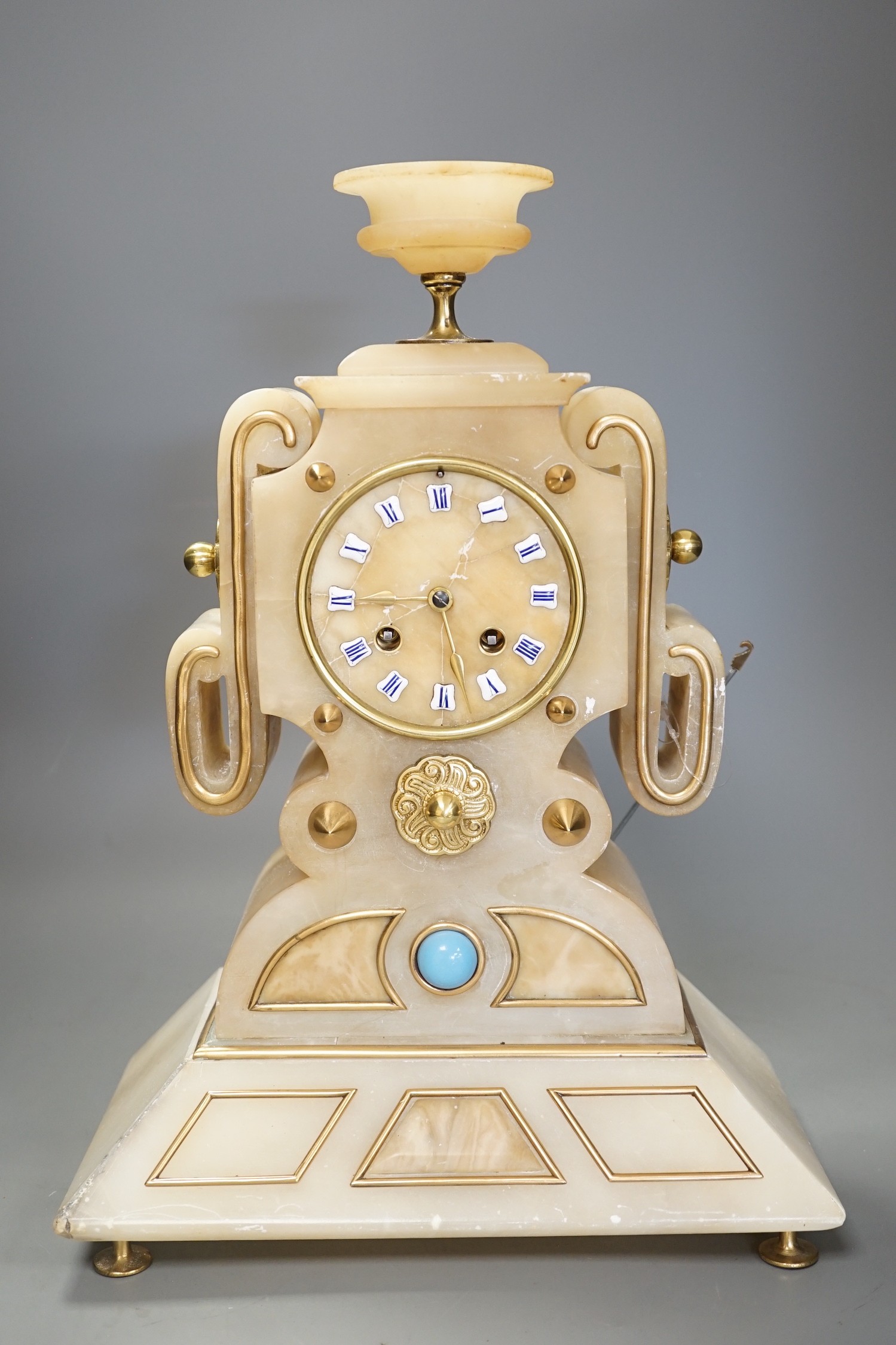 A French Art-Deco style alabaster mantel clock, 39cm tall